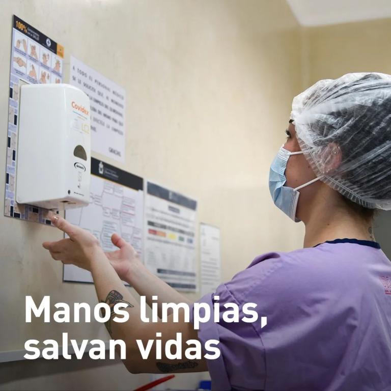 A women doctor using hand sanitiser