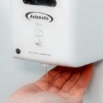 Sanitizing hands by automatic Hand sanitiser dispenser