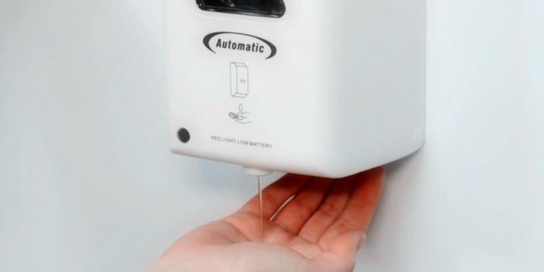 Sanitizing hands by automatic Hand sanitiser dispenser